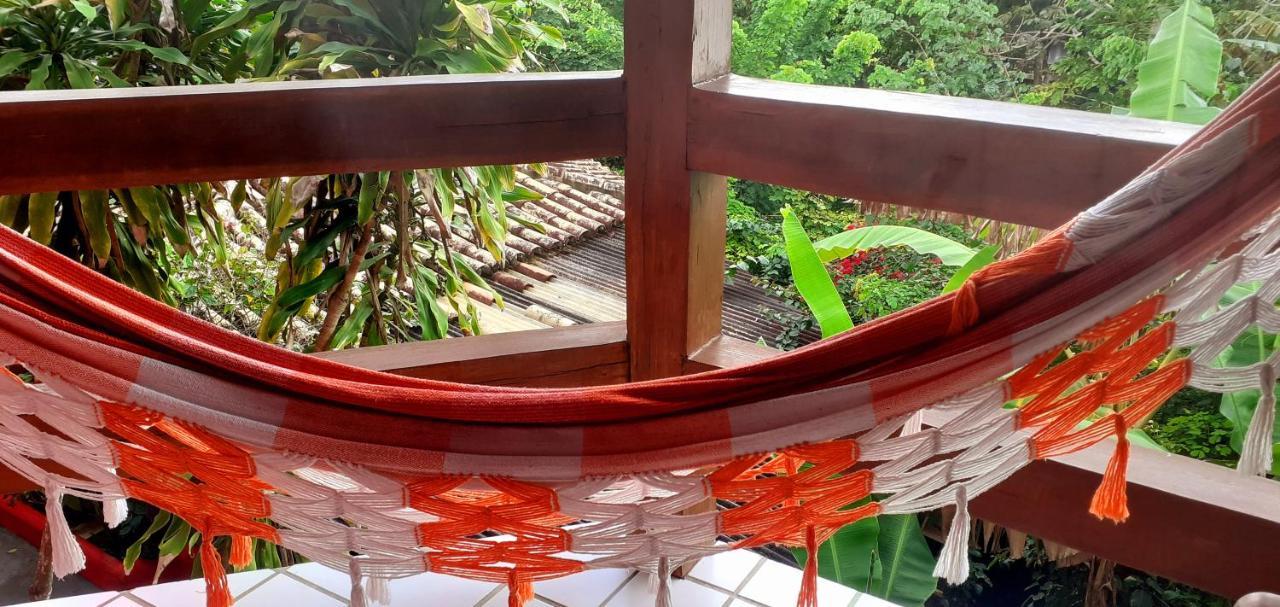 Novos Baianos Hostel E Pousada Порту-Сегуру Экстерьер фото A hammock
