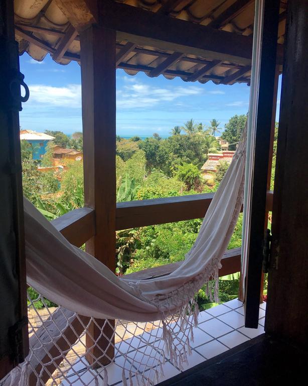 Novos Baianos Hostel E Pousada Порту-Сегуру Экстерьер фото Hammock in a hotel in San Juan del Sur, Nicaragua
